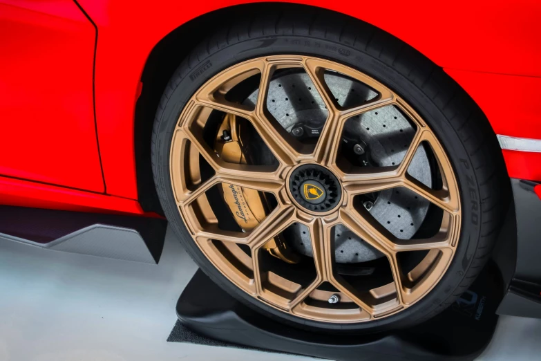 the wheels and tires of a ferrari red sports car