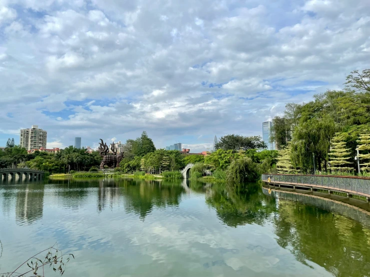 a beautiful sky over the park and a water way