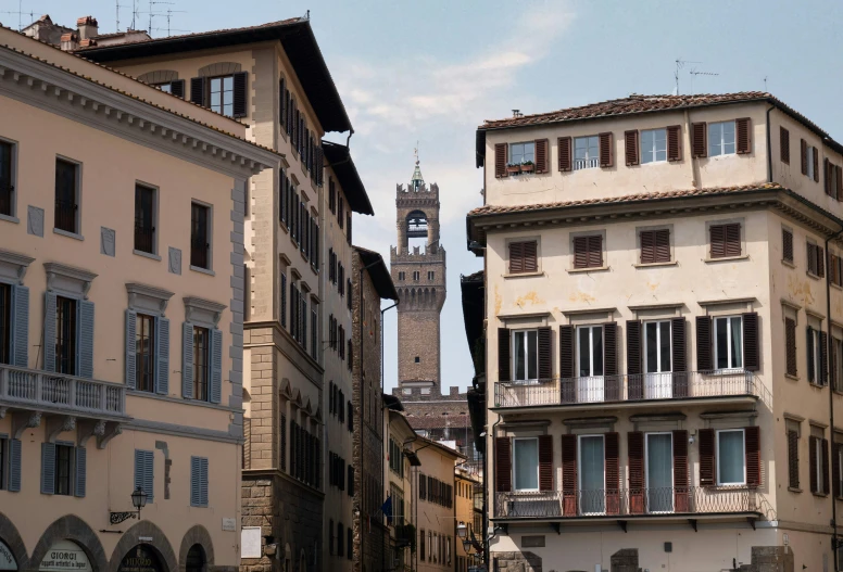 view of a tower and buildings from the street