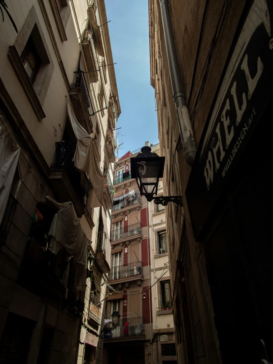 a street view looking up into a tall city