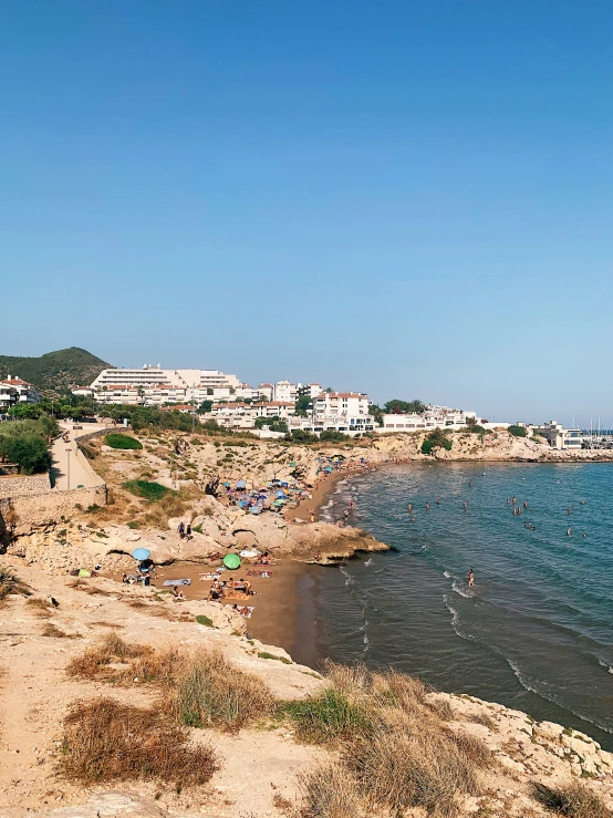 a large body of water sitting next to a sandy beach