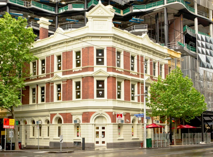 a big building on the corner of the street