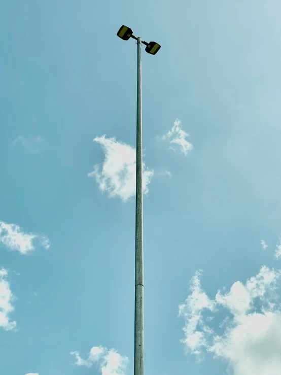 an old looking street lamp looks like it was painted yellow
