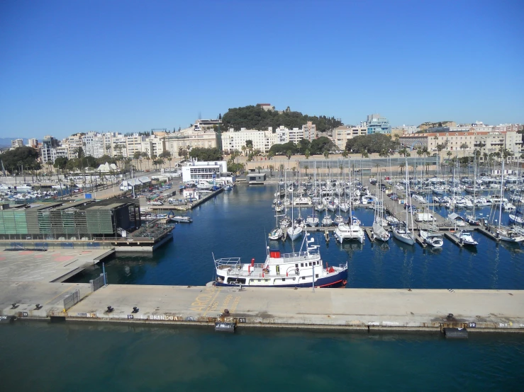 boats at dock in city next to buildings