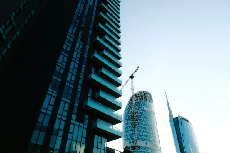 the skyline with tall buildings and a crane