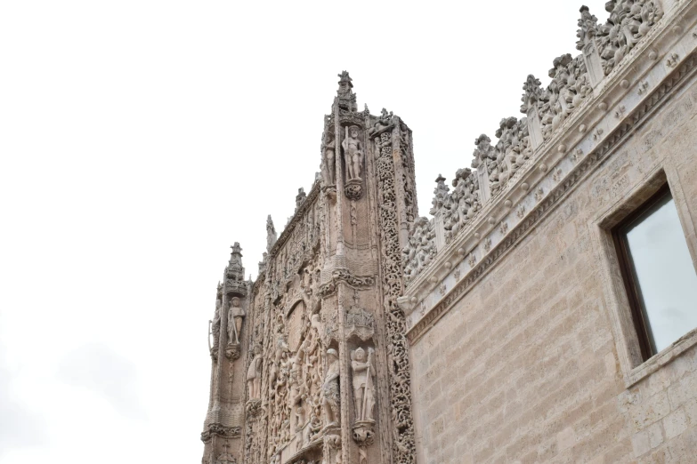 a close up of a large stone church steeple