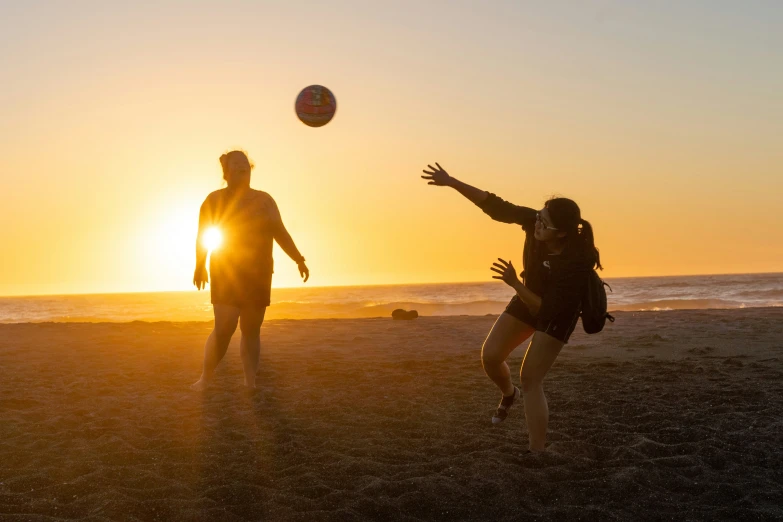 a couple of people playing a game of frisbee