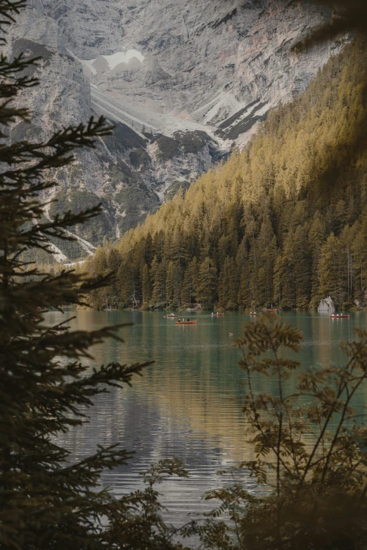 the mountains are reflected in the calm lake