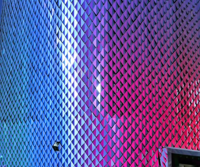 an abstract colorful wall with a traffic signal