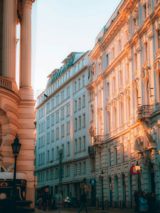 a row of buildings in the city as the sun sets