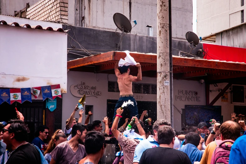 a person in the middle of a crowd on his back