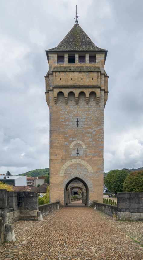 the tower is built in to the stone pavement