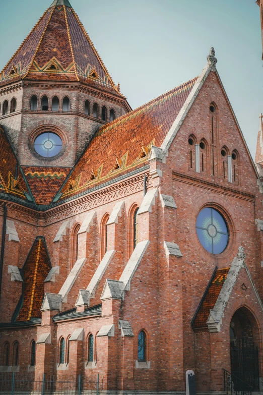 a church that has several clocks on the front