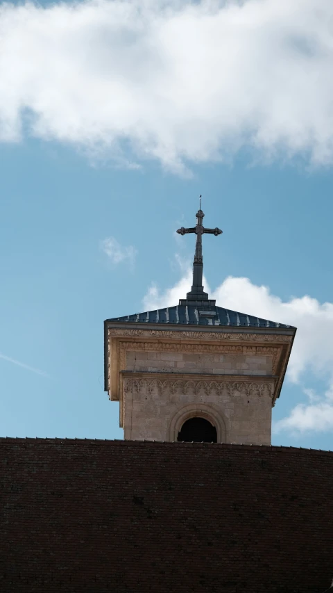 there is a cross on top of the building