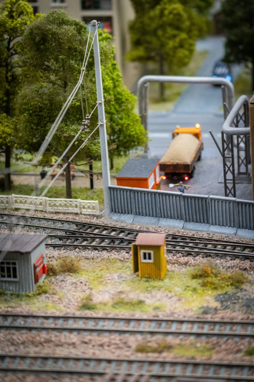 a model train layout and its tracks with the building on top