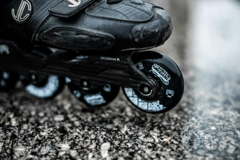 a person riding on the skate board with their legs extended