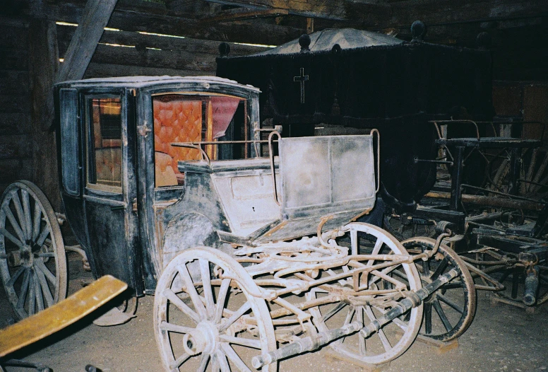 an old fashioned coach is being displayed