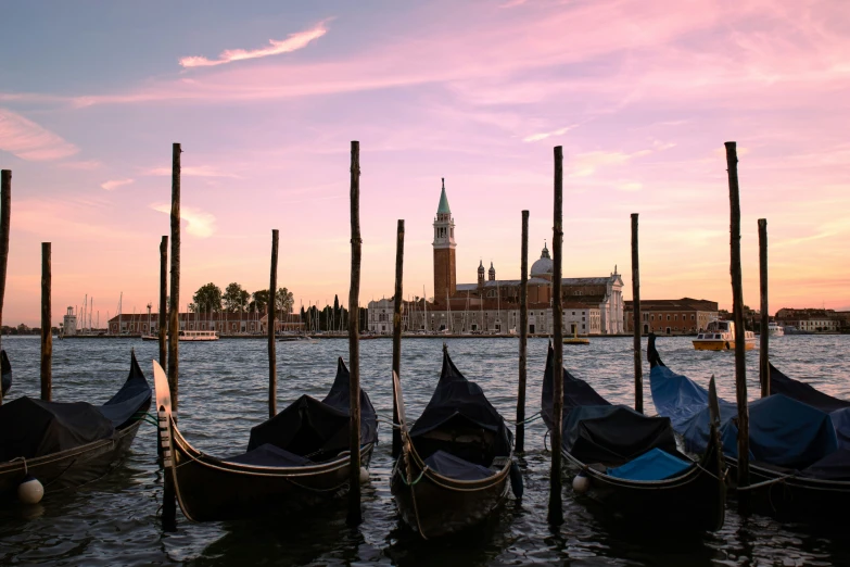 a view of the canal in venice during sunset