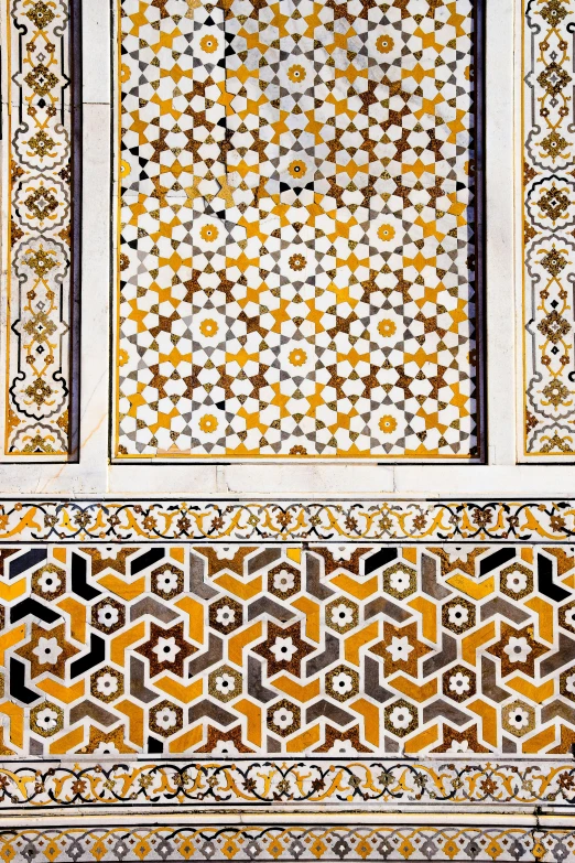 a close up of an intricate tile in the shape of hexagon