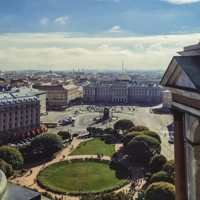 a wide view of a big building with buildings around it