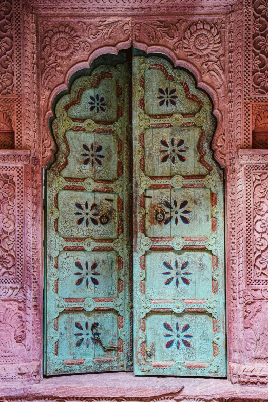 a window covered in intricate designs in a building