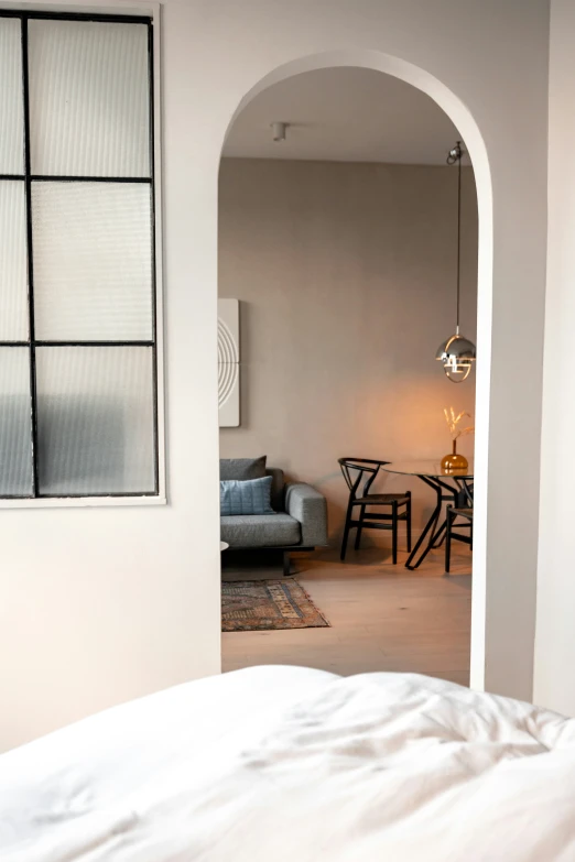 a living room filled with furniture and a window