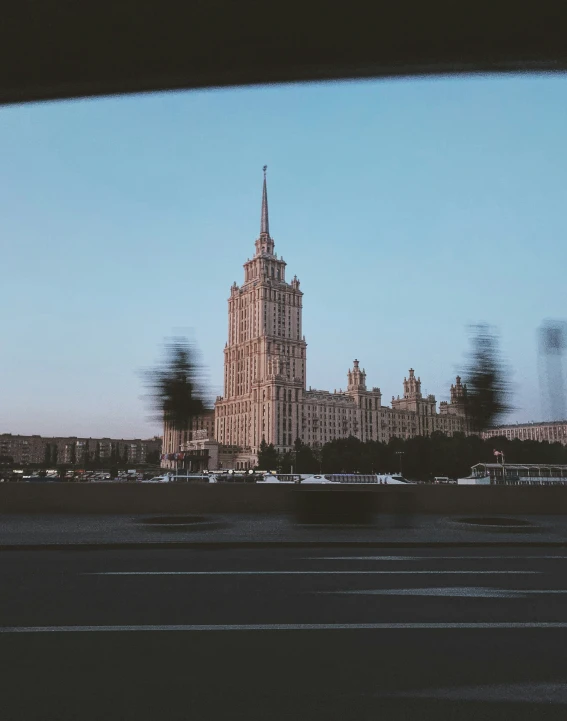 a large cathedral on top of a building in a city