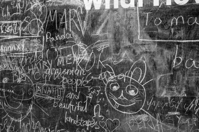 chalk writing and other writing on a blackboard