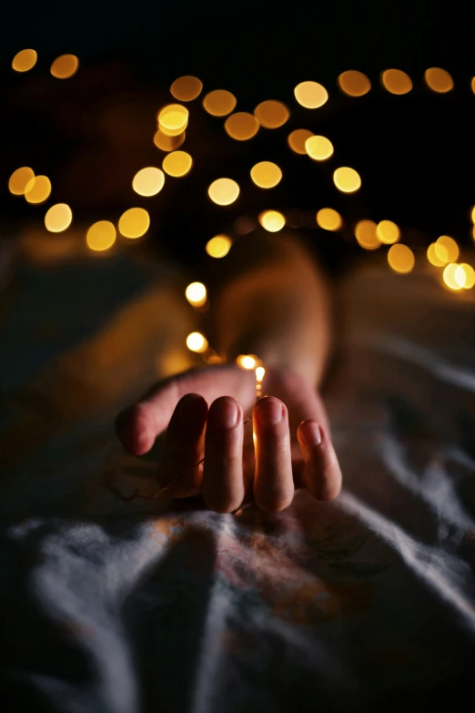 a close - up of a person's hand and lights