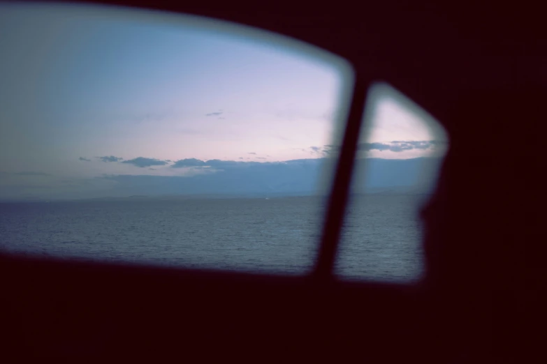 a view from inside a vehicle on a body of water