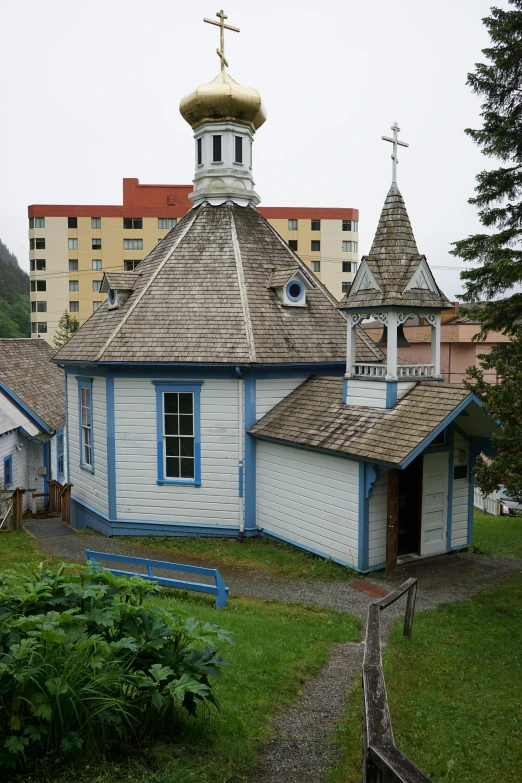 a church building with a large clock on the tower