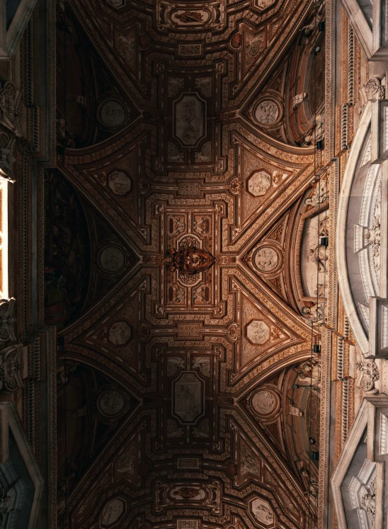 a cathedral ceiling with ornate designs in the middle