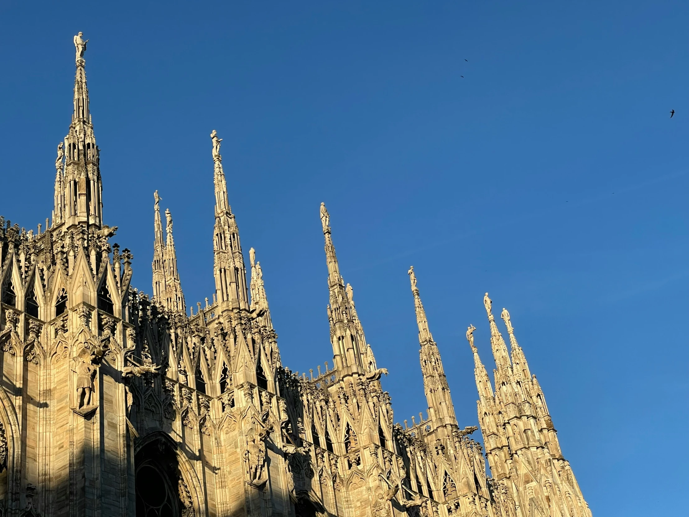 a large cathedral against a blue sky on a clear day