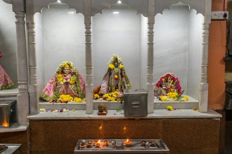 a religious shrine decorated with flowers and candles