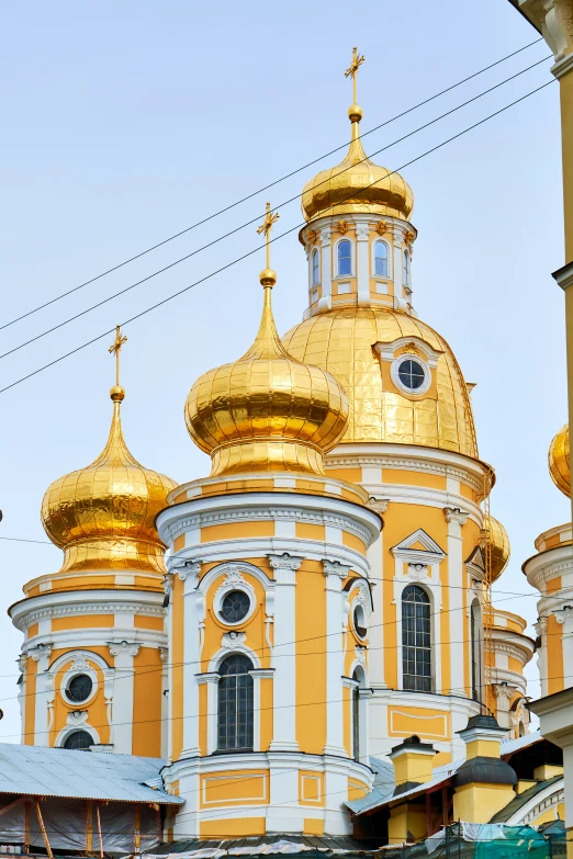 a church with gold domes, and gold trim