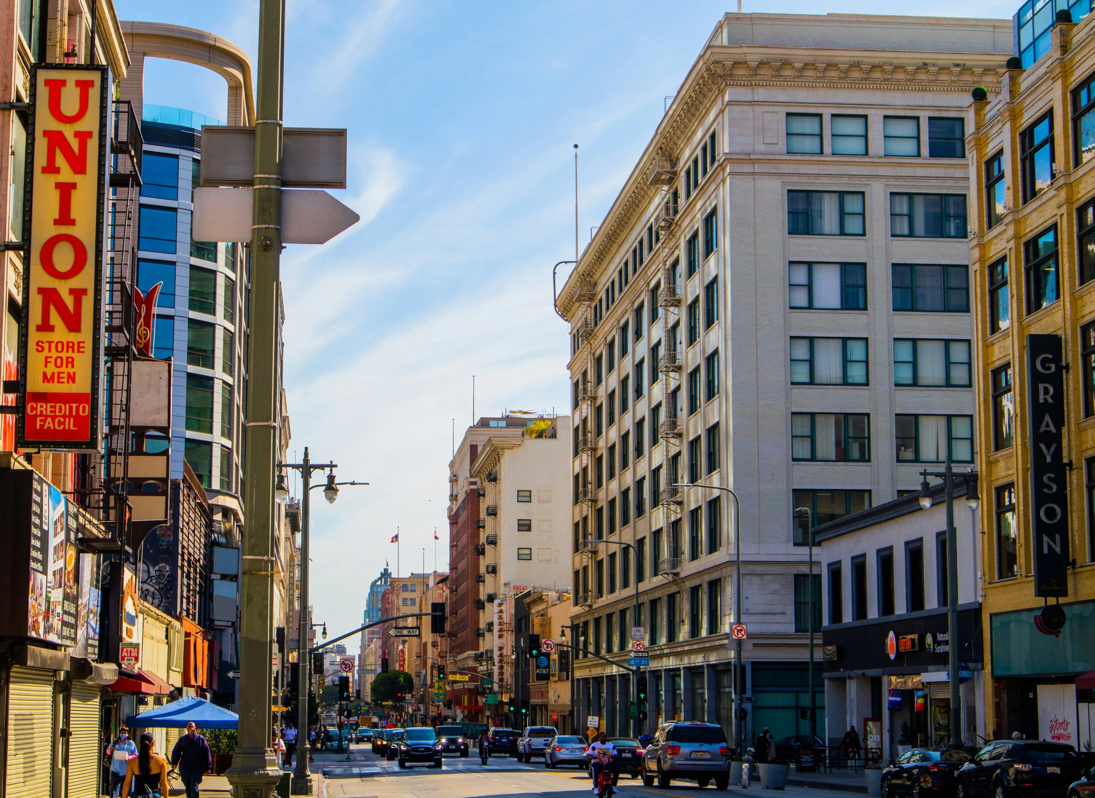 a city with tall buildings and lots of neon signs