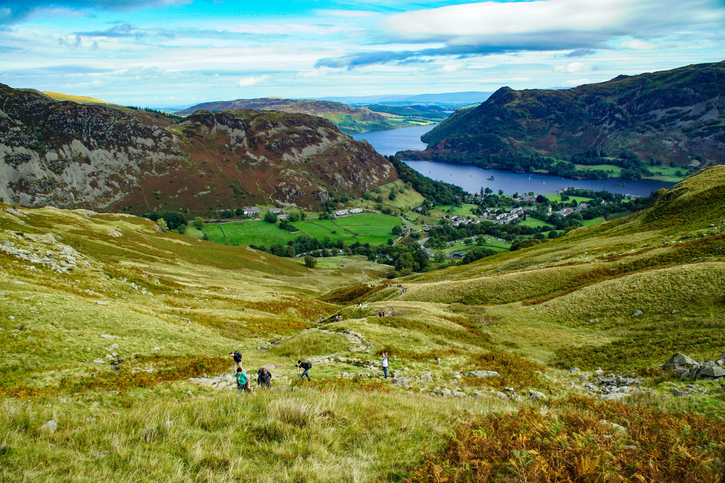 the view of two mountains and lake from the top of a mountain