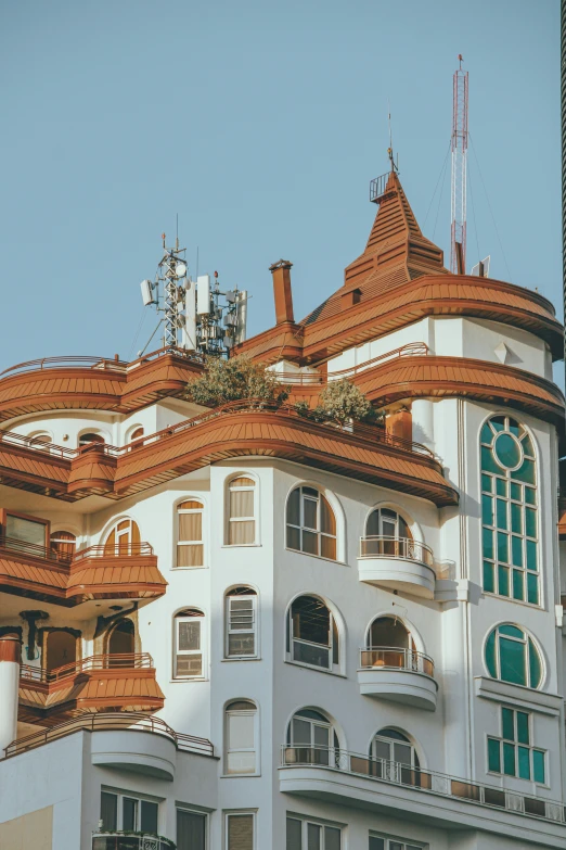 large building with green and brown tiled roof