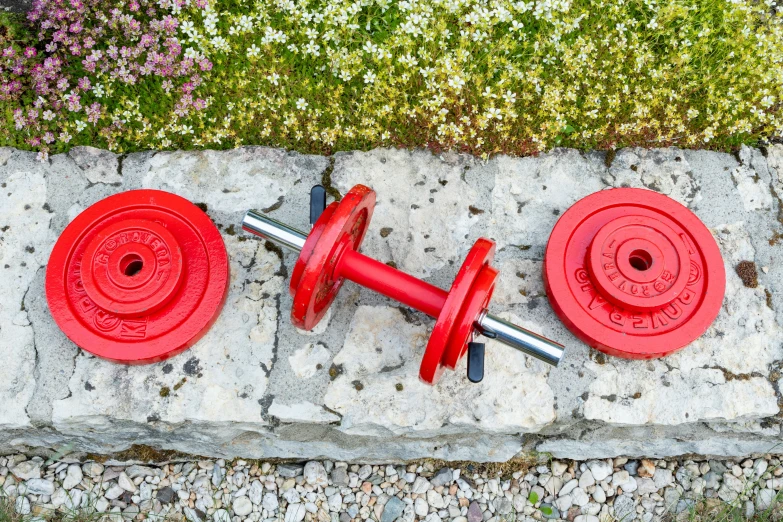 some red objects sitting on top of a sidewalk