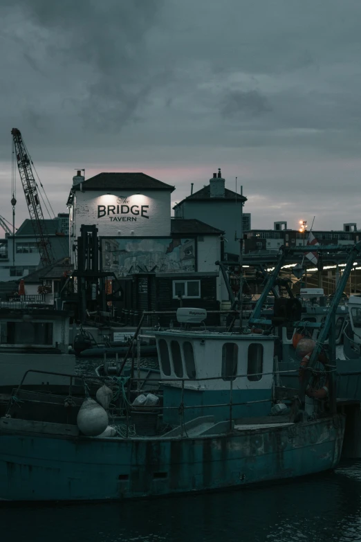 a boat sitting in the water at night