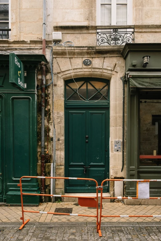 green doorways and brown doors in an old building