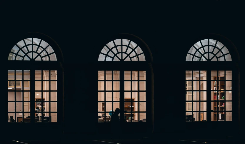 the interior of an old building with large windows