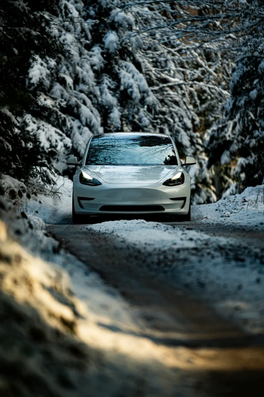 a car driving on a snow covered road