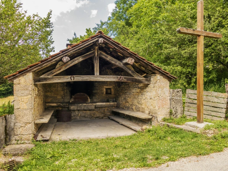 an old stone chapel in a small forest