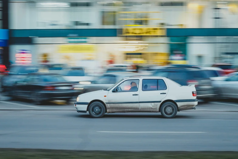 an automobile driving on a road with the doors open