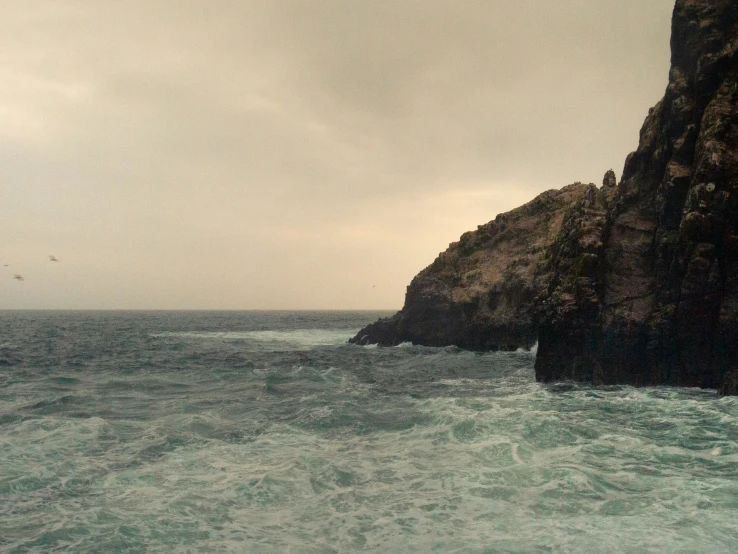 a very high cliff on the edge of the ocean