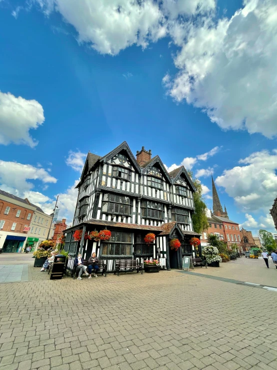 a brick building with a clock on the top of it