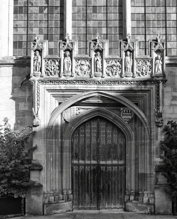 an ornate, elaborate door in a large stone building