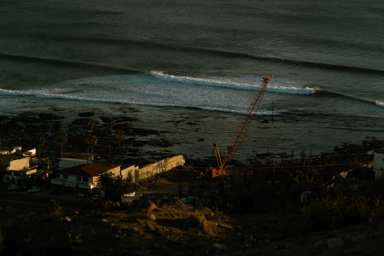 an aerial view shows the ocean and buildings