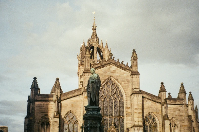 a large ornate church building with a statue on top